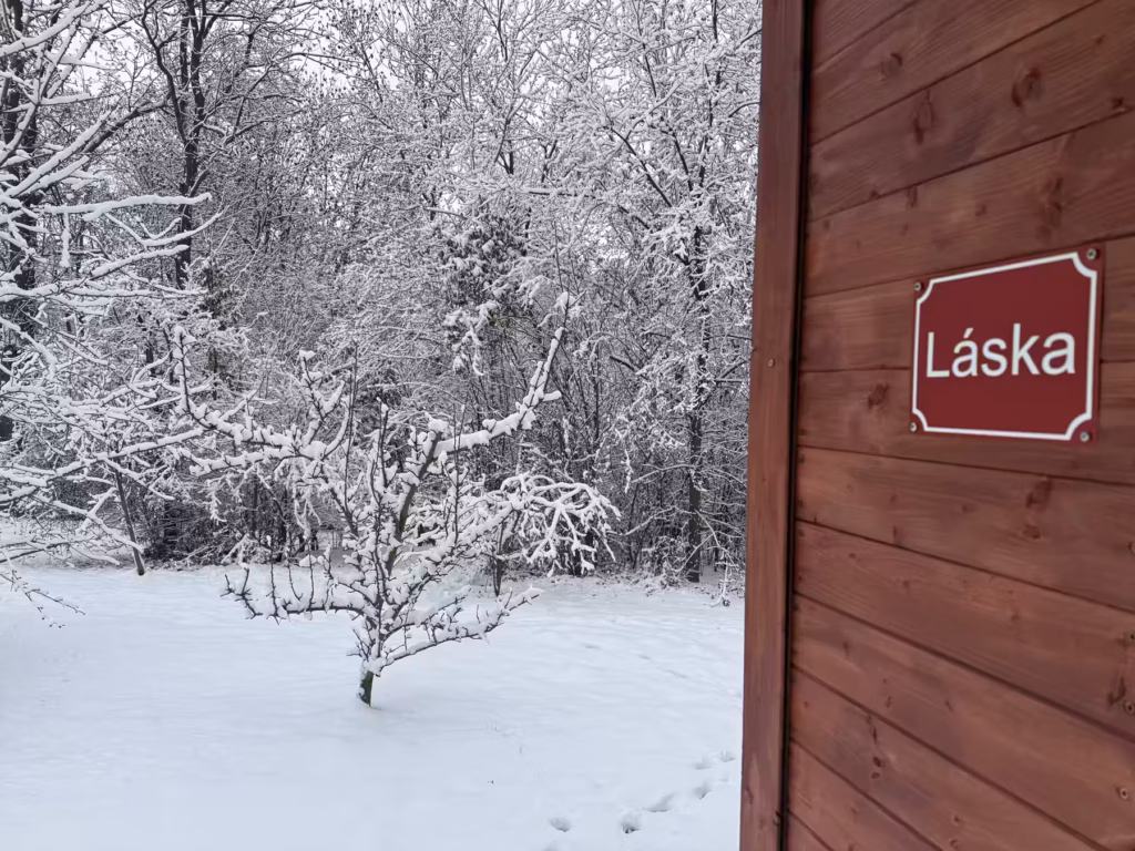 Cabin of Love wrapped in snow, dark retreat in winter